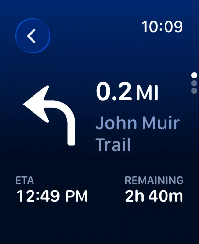 Deep-blue turn-by-turn screen showing a left turn in 0.2 miles on the John Muir Trail