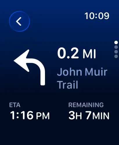 Deep-blue turn-by-turn screen showing a left turn in 0.2 miles on the John Muir Trail