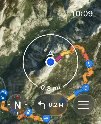 Point-to-point route created on the Apple Watch over satellite imagery, with a location puck and search-radius ring
